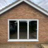 White aluminium bifold doors fitted by WDC Anglia