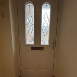 White composite door with decorative glass