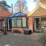 Black conservatory and patio doors by WDC Anglia