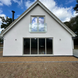 Grey uPVC windows and bifold doors on a new-build home, fitted by WDC Anglia
